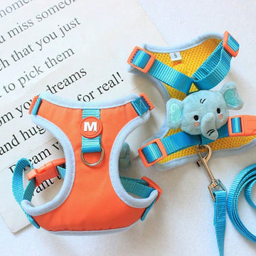 Blue cartoon elephant pet harness and leash set with adjustable vest-style design for cats or dogs, featuring a colorblock pattern and breathable mesh look.