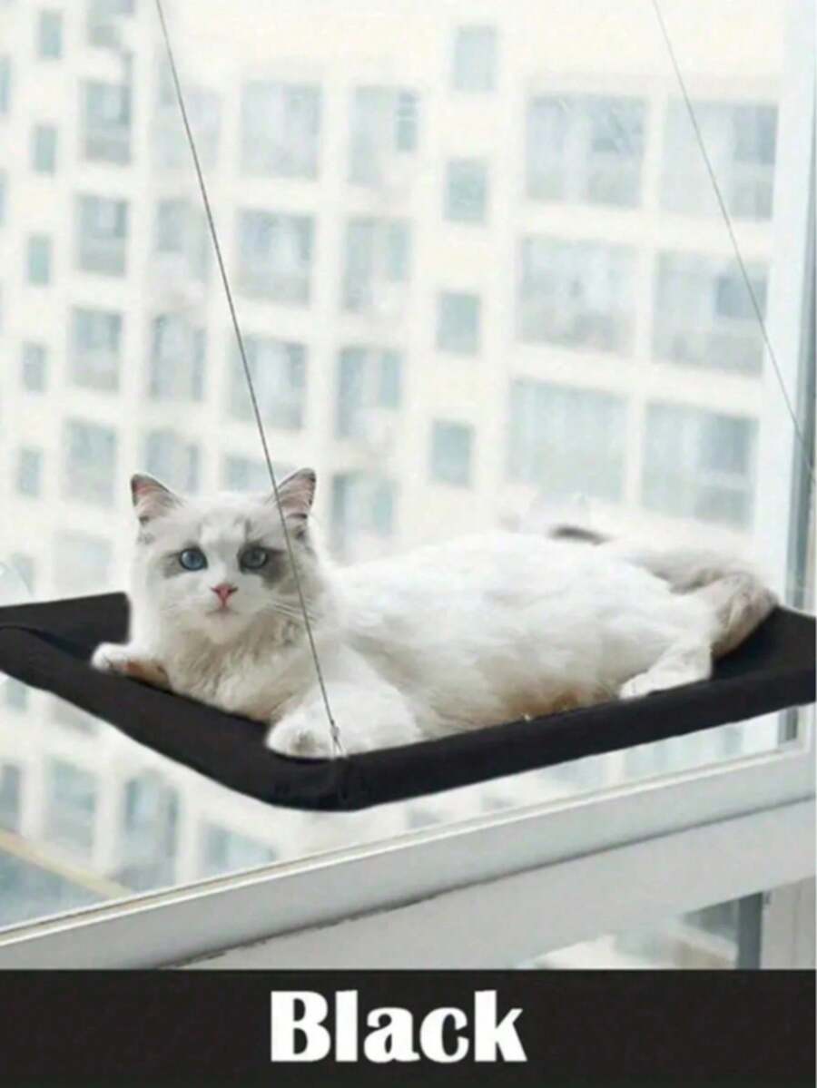 Suspended cat window hammock bed with sturdy ABS frame, mounting brackets, and cozy blanket installed on a glass window.