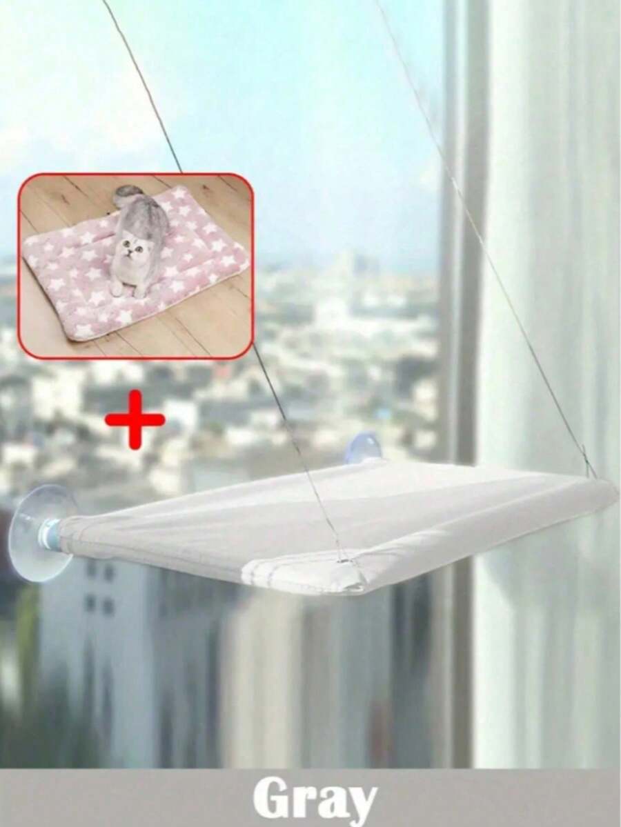 Suspended cat window hammock bed with sturdy ABS frame, mounting brackets, and cozy blanket installed on a glass window.
