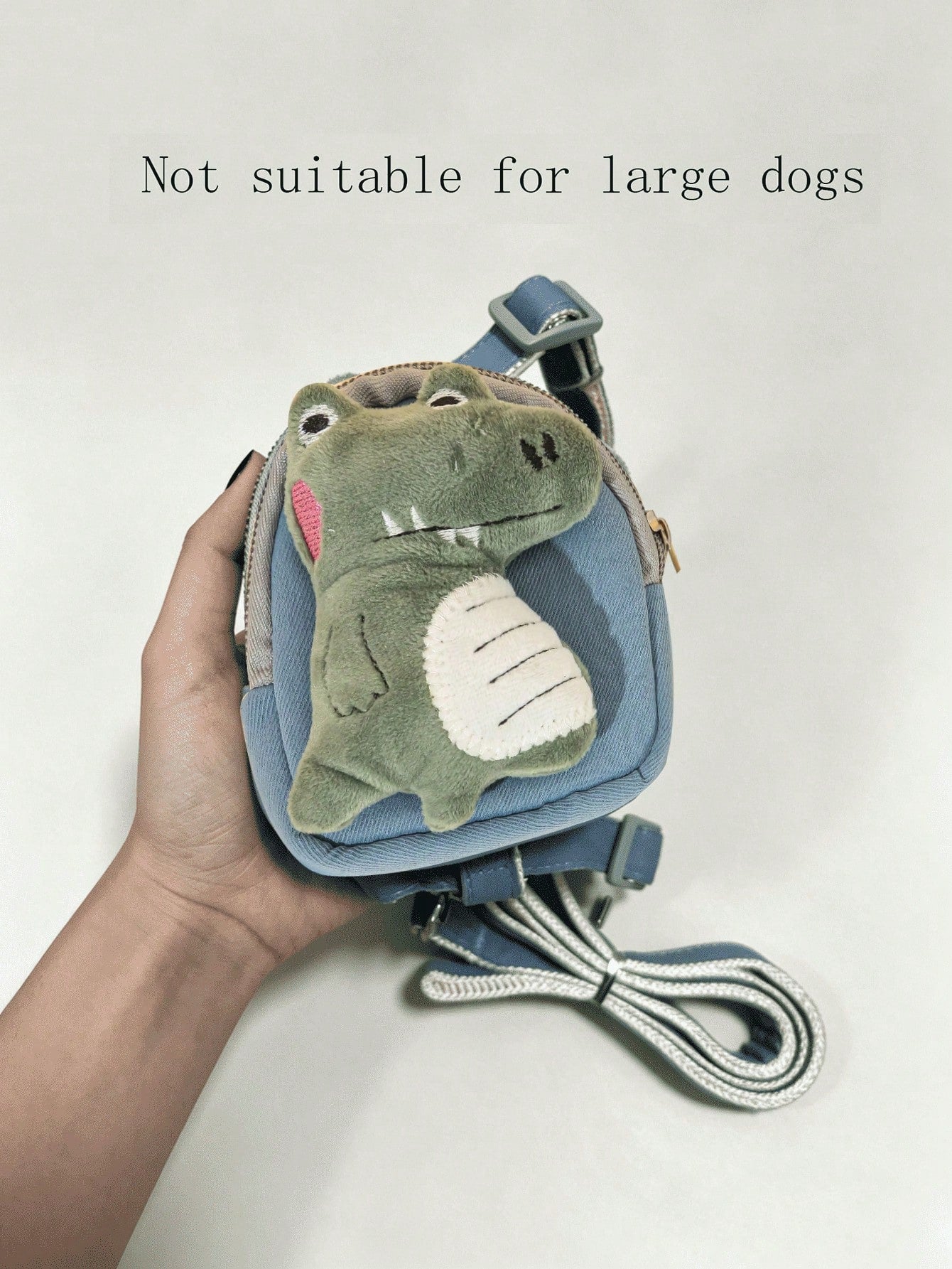 Multicolor plush dinosaur decor pet backpack with collar, harness and leash set for cats and small dogs, designed to carry food or poop bags.