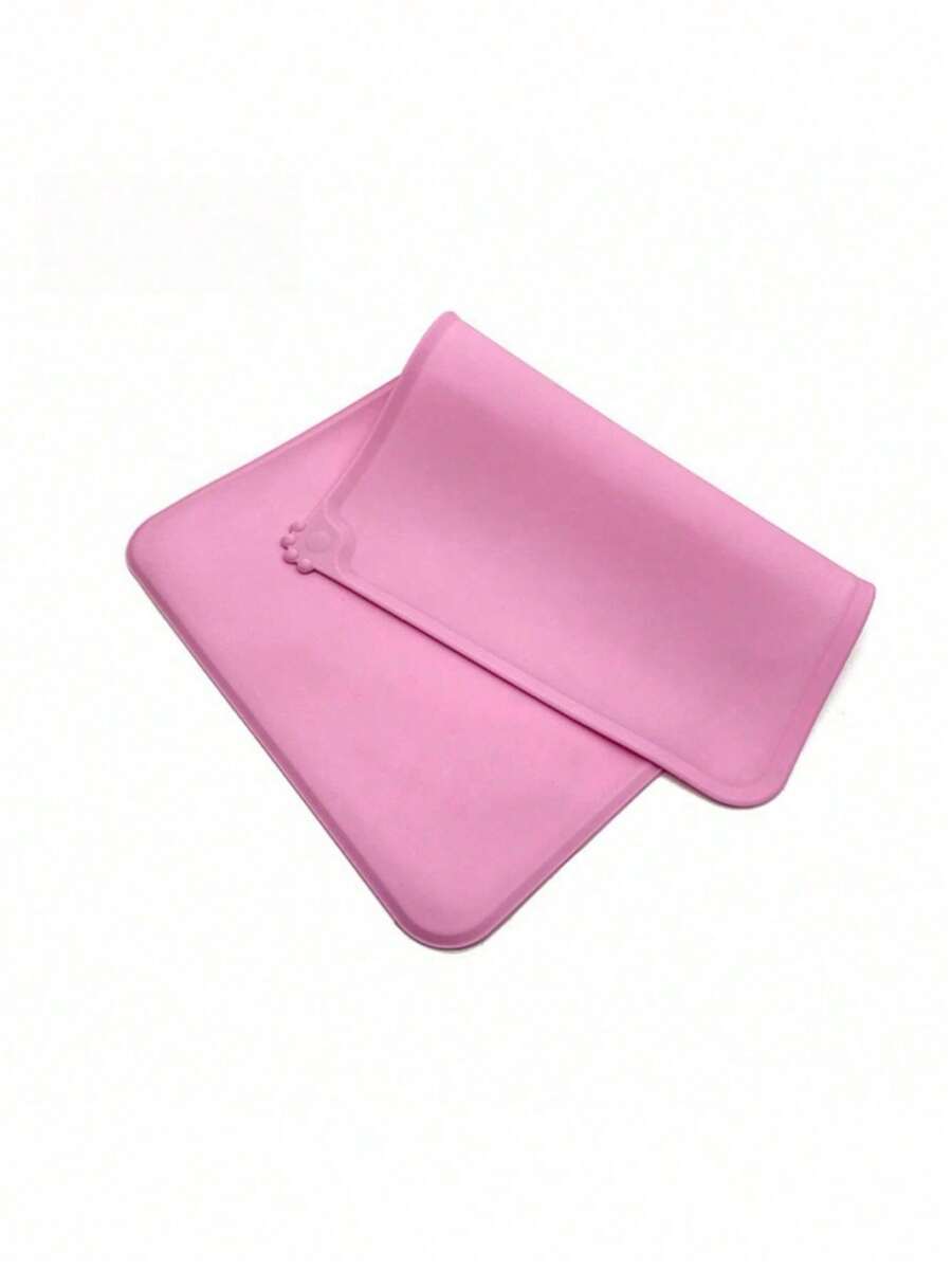 Rectangular solid color silicone pet food bowl mat with non-slip and waterproof surface for dog and cat feeding.