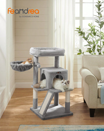 Beige 37.8-inch multi-level wooden cat tree featuring a scratching ramp ladder, 2-door cat cave, widened top perch, and hanging pompom toy for indoor cats.