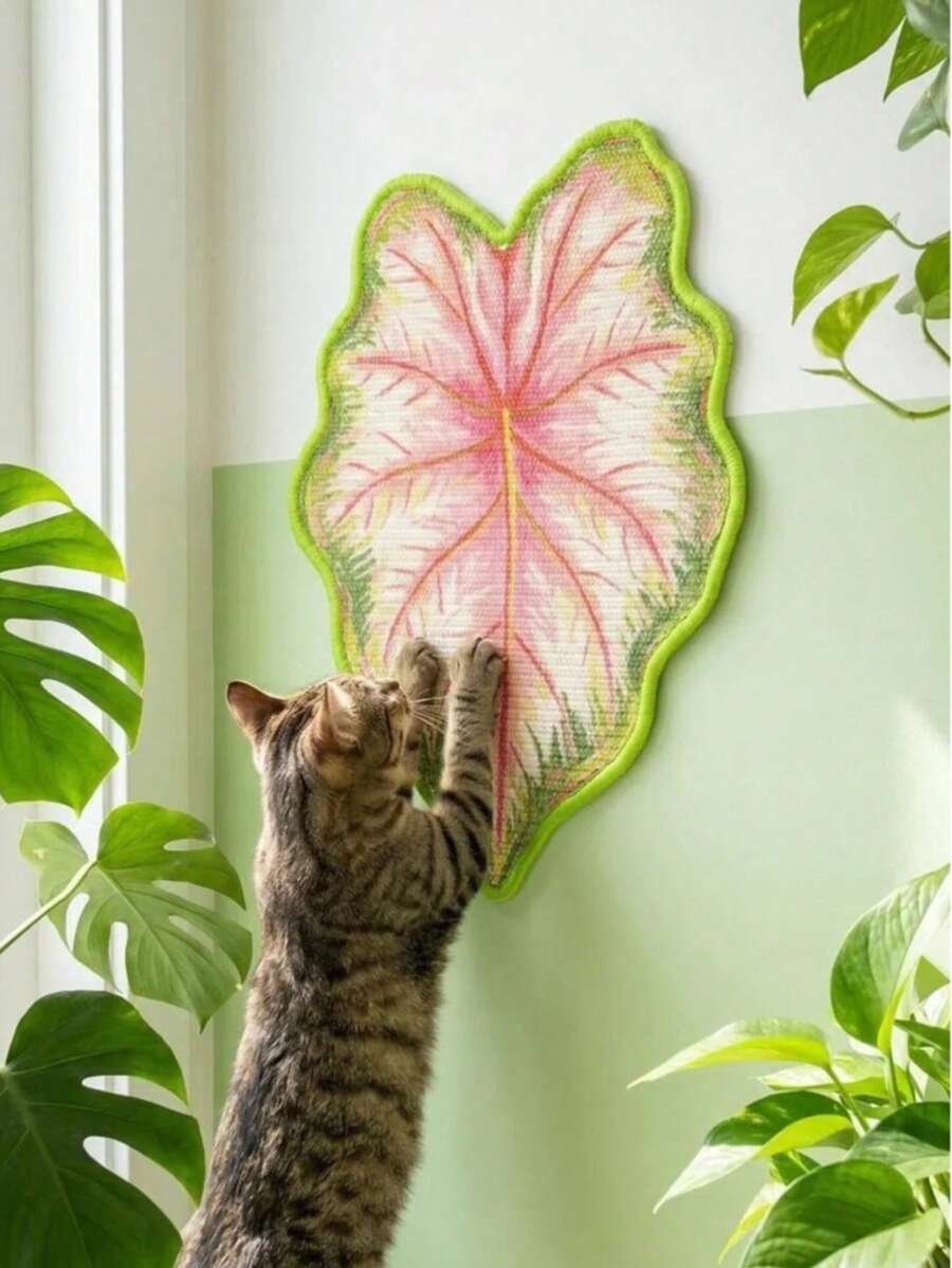 Green leaf shaped cat scratching board made of natural sisal for indoor cat claw grinding and play