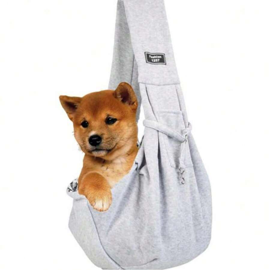 Multicolor polyester pet sling carrier bag with animal pattern for carrying cats and dogs during outdoor travel.