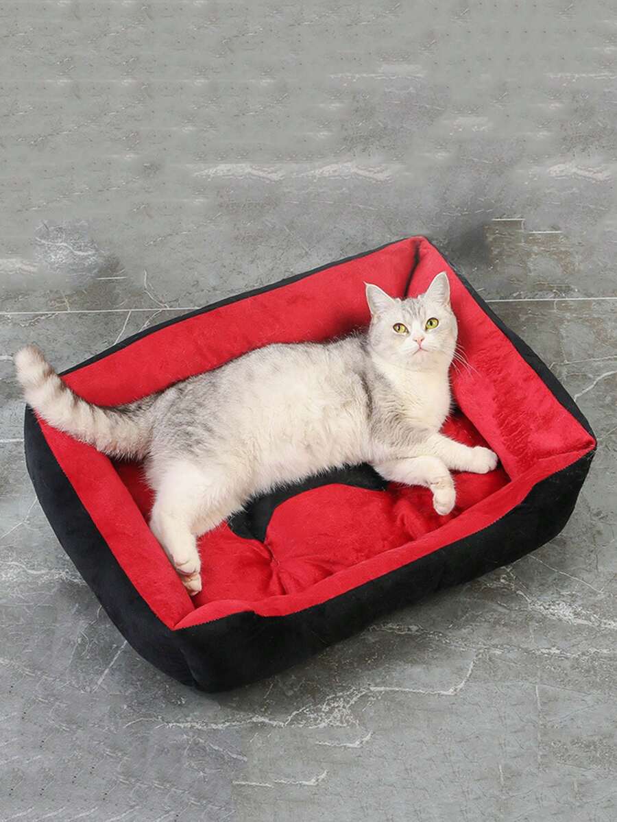 Black bone shaped pet nest bed for small dogs and cats made of polyester filling and material.