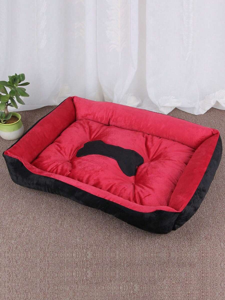 Black bone shaped pet nest bed for small dogs and cats made of polyester filling and material.