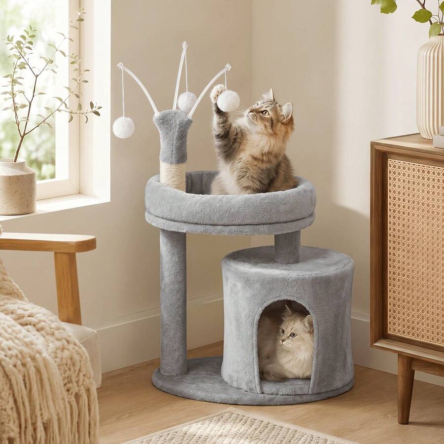 Gray 23.6-inch compact multi-level cat tree tower for indoor cats featuring a soft padded perch, cozy hideaway cave, and dangling pom-pom toy.