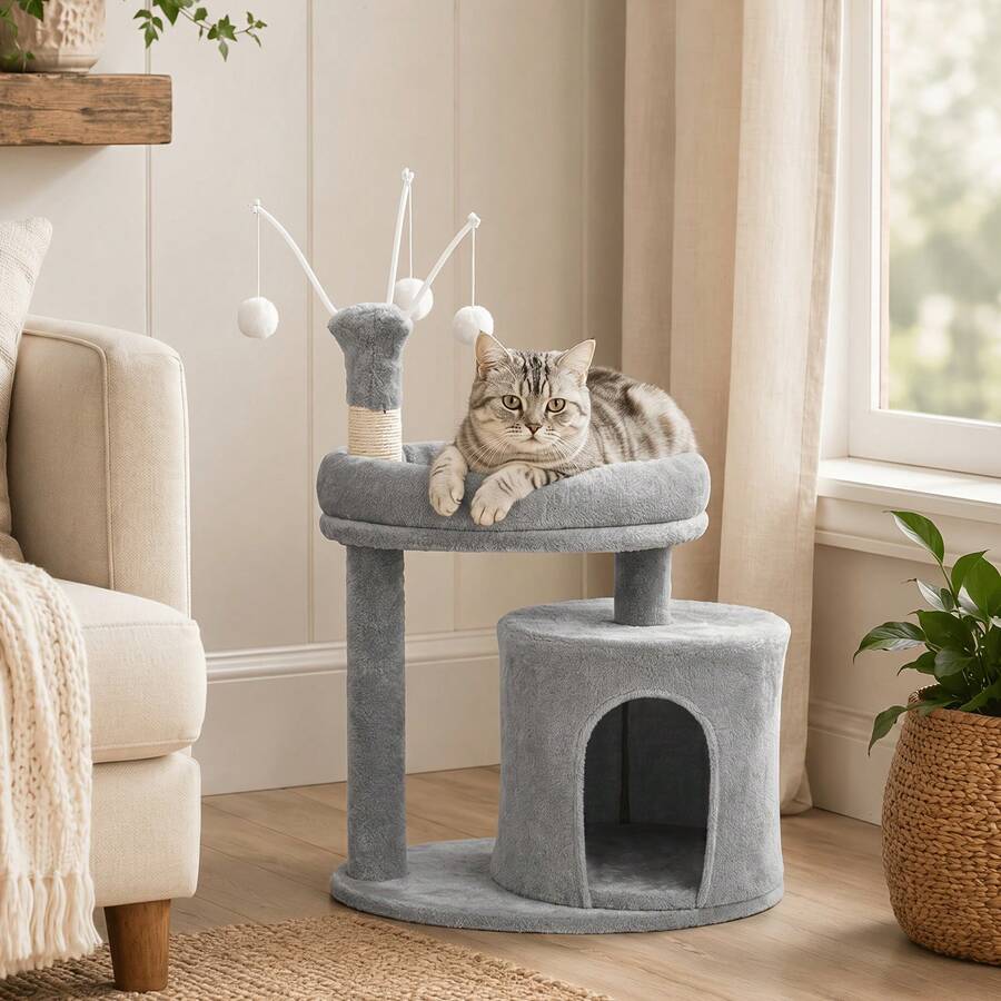 Gray 23.6-inch compact multi-level cat tree tower for indoor cats featuring a soft padded perch, cozy hideaway cave, and dangling pom-pom toy.