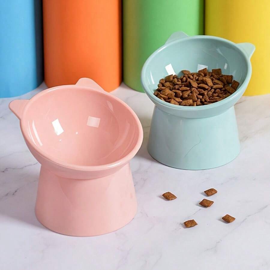Set of 3 cat-ear shaped raised cat bowls in pink, green, and blue made of PMMA material with elevated anti-slip base
