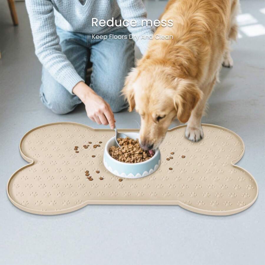 Multicolor bone-shaped silicone pet feeding mat with high spill-proof edge for cat and dog food and water bowls.