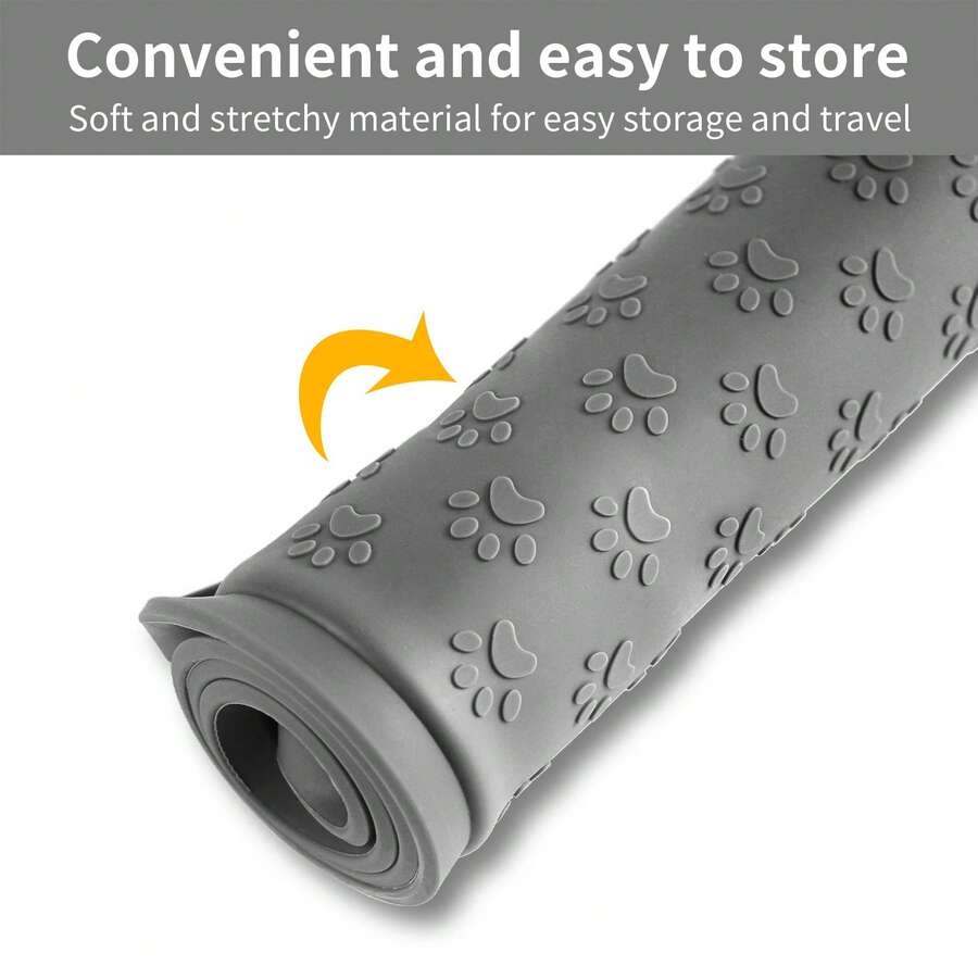 Beige silicone pet placemat with embossed paw print accents designed to catch food and water spills for dogs and cats.
