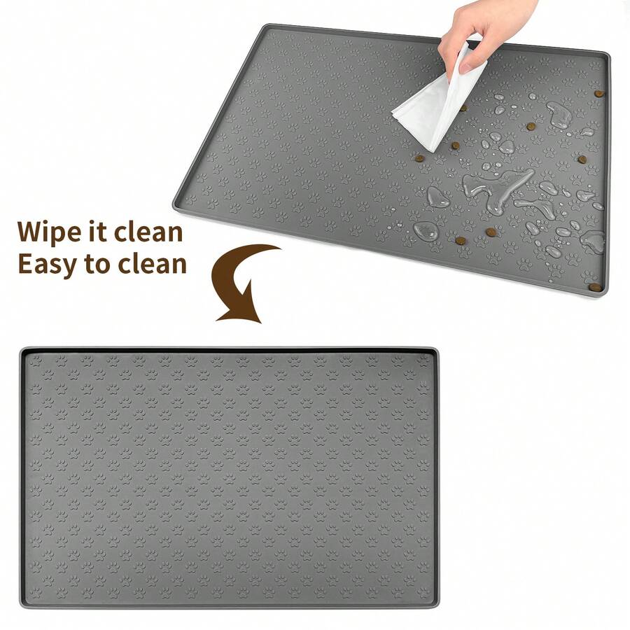 Beige silicone pet placemat with embossed paw print accents designed to catch food and water spills for dogs and cats.