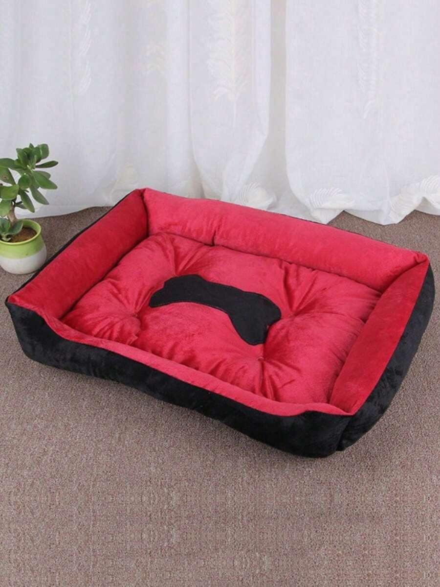 Black bone shaped pet nest bed for small dogs and cats made of polyester filling and material.