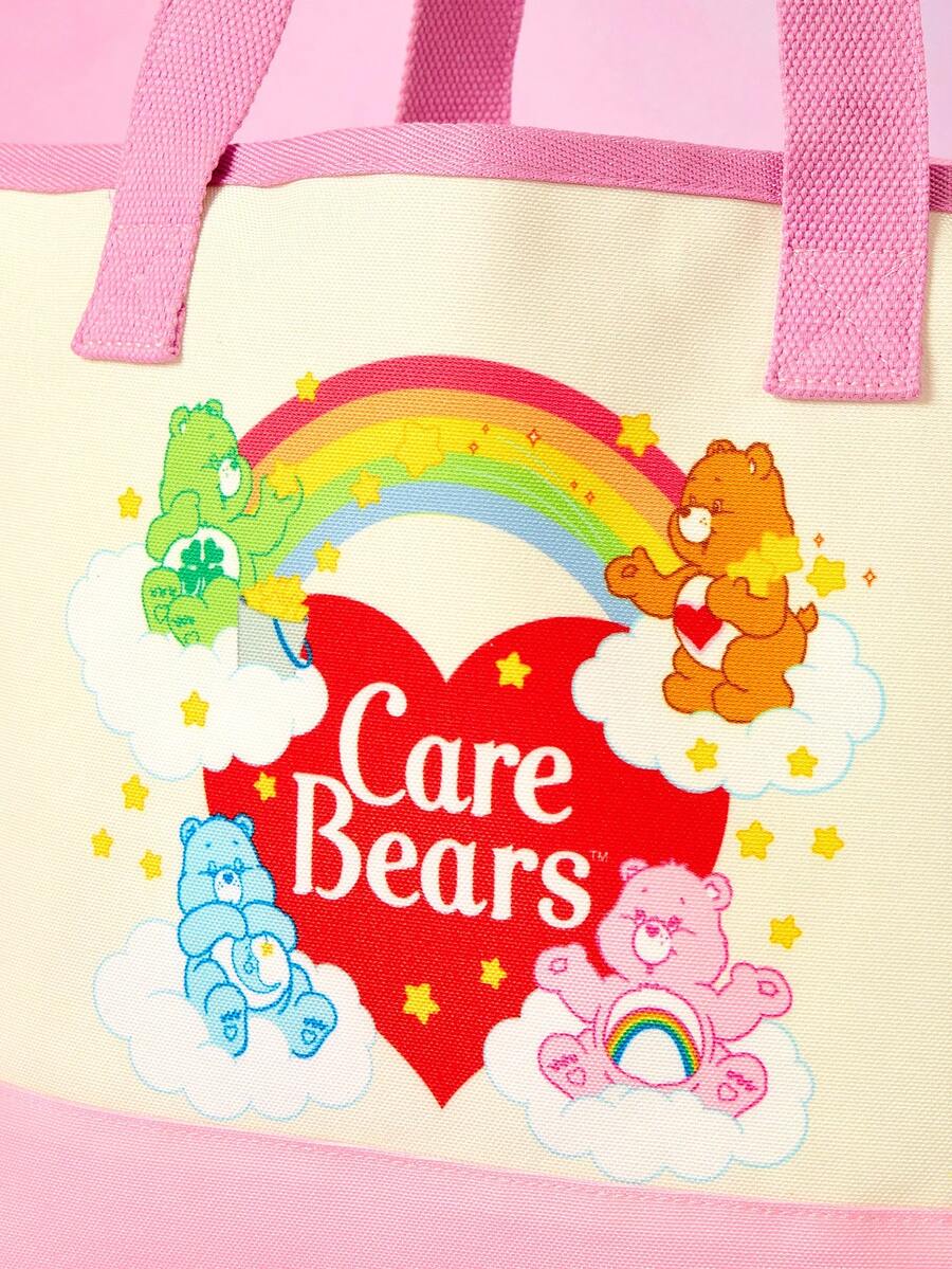 Pink and white canvas pet carrier tote bag with cute cartoon print, dual top handles, and shoulder strap for small dogs and cats.