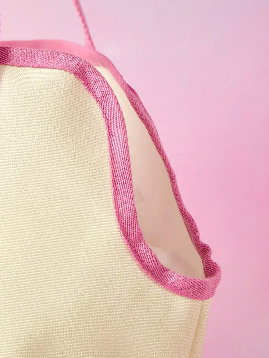 Pink and white canvas pet carrier tote bag with cute cartoon print, dual top handles, and shoulder strap for small dogs and cats.