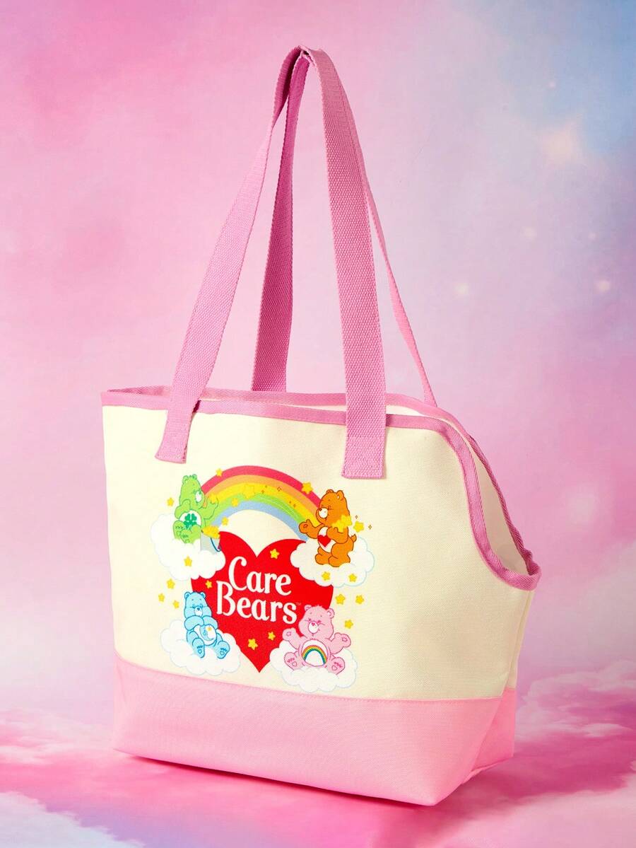 Pink and white canvas pet carrier tote bag with cute cartoon print, dual top handles, and shoulder strap for small dogs and cats.
